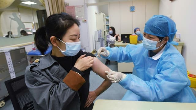 International: En Chine,  des non-vaccinés risquent la prison